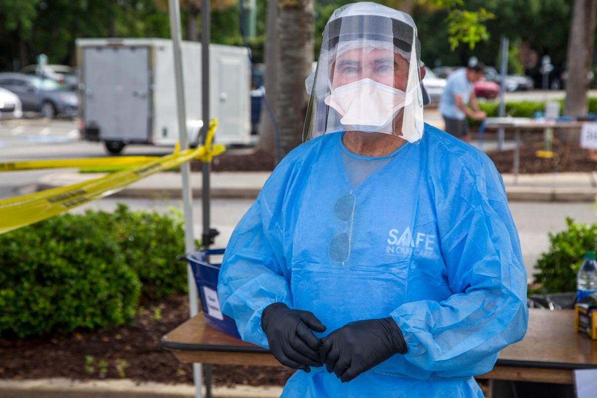 Dr. Gerald Harmon, vice president of medical affairs at Tidelands Health, wears personal protective equipment at a local coronavirus testing clinic.
