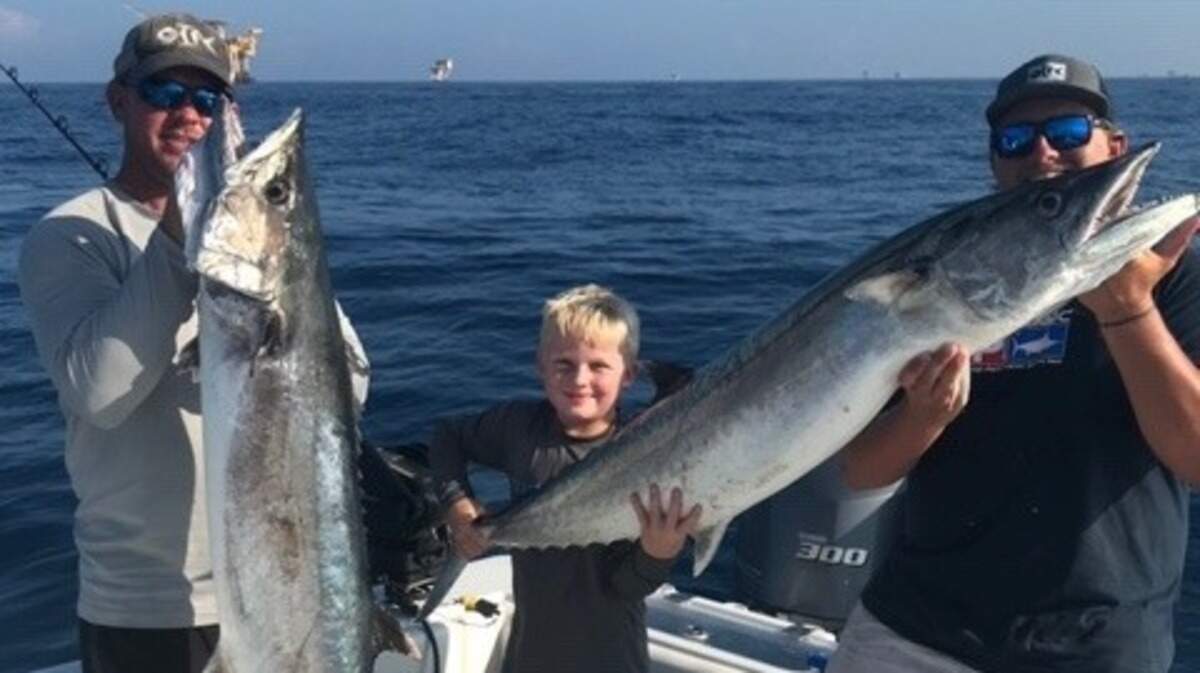 Capt. Brant McMullan, son Brayden McMullan and Capt. Austin Aycock of Ocean Isle Fishing Center show off king mackerel weighing 45 and 50 pounds caught recently. Ocean Isle Fishing Center is hosting the Jolly Mon King Mackerel Tournament this weekend.