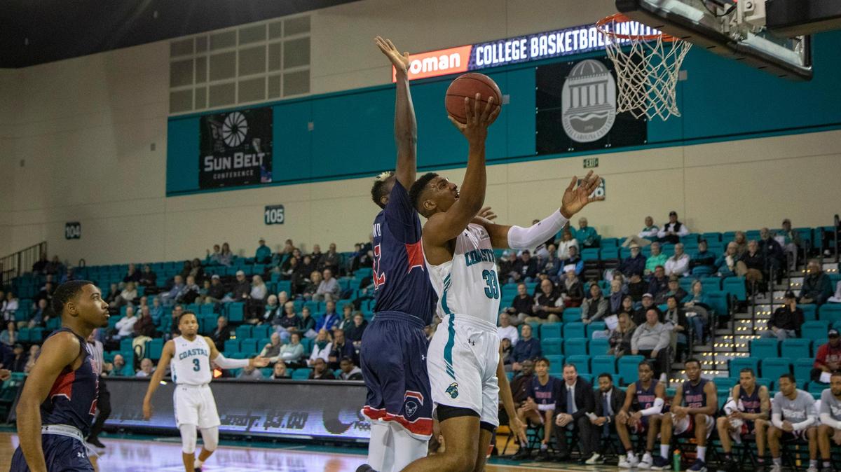 Coastal Carolina forward Tommy Burton, who will be a senior this season, lays up a basket against Howard in March in the opening round of the 2019 Roman College Basketball Invitational (CBI) Tournament at the HTC Center in Conway. Coastal opens the 2019-20 season on Nov. 5 against Campbell at the HTC Center.