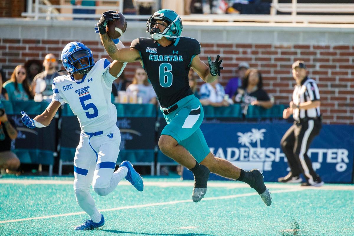 Coastal’s Jaivon Heiligh draws in a pass reception coming down on the 1-yard line against Georgia State in the first quarter on Saturday. Coastal Carolina University host Georgia State for homecoming on Saturday. Nov. 13, 2021.