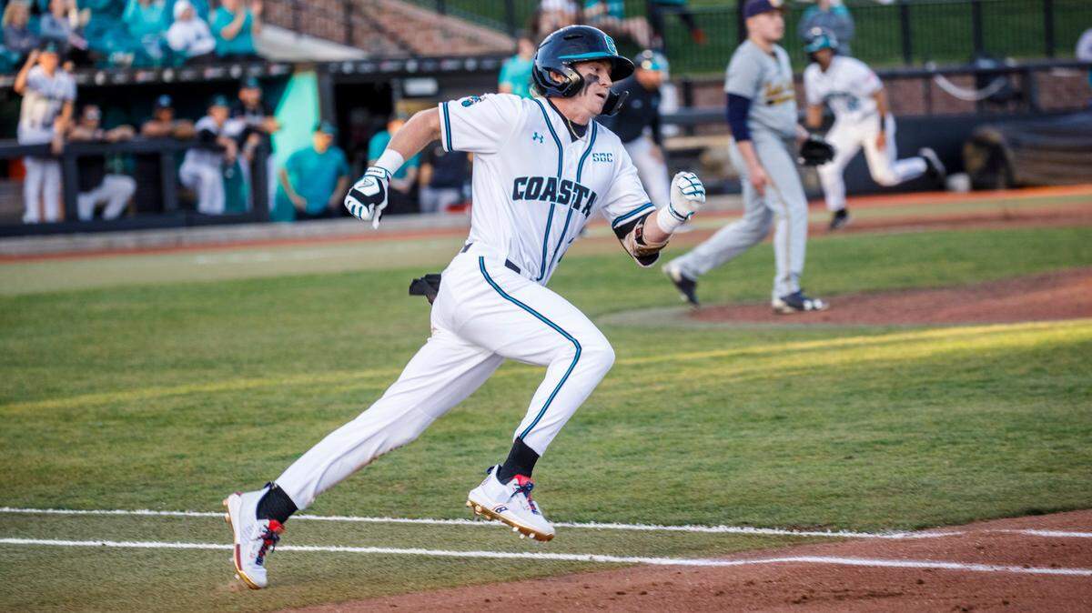 Coastal Carolina’s Dale Thomas records a hit in the third inning against Kent State during the Baseball at the Beach Tournament at Spring Brooks Stadium in Conway on Friday afternoon. February 18, 2022.