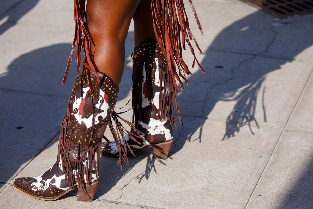 Country music fans arrive for the first night Carolina Country Music Fest 2024. The four day event is expected to draw 30,000 each night at the Burroughs and Chapin Pavilion Place in Myrtle Beach, S.C. Thursday, June 6, 2024.