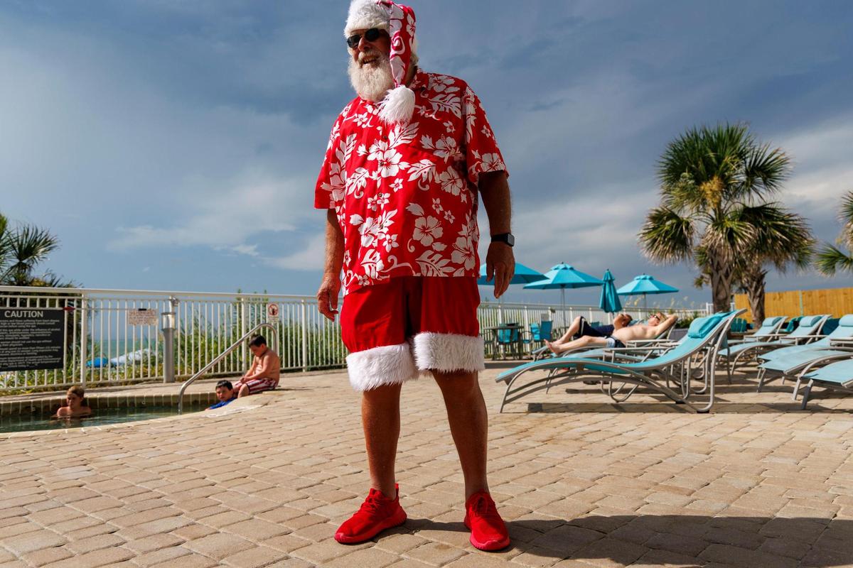 Santa Claus, or Greg Calvert, has been portraying the Jolly Old Elf since 2019. Known as Santa Greg of the Marshwalk, he uses summer to showcase what Santa does on vacation in the Myrtle Beach, making appearances at local hotels and even at karoake events. July 18, 2025.