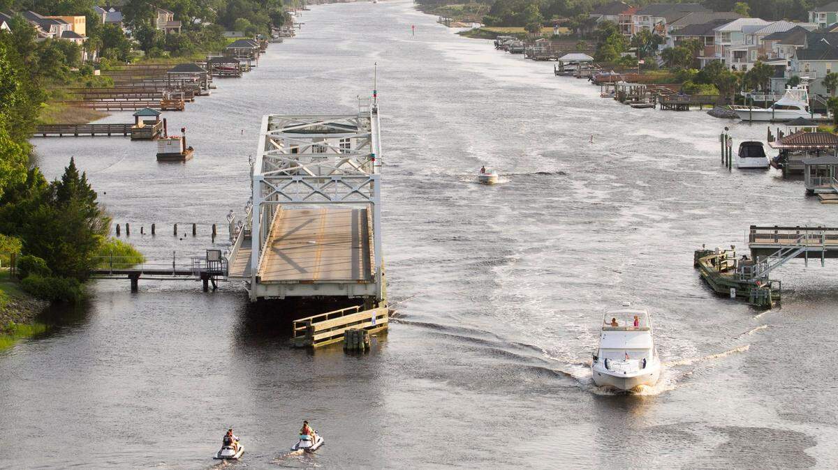 The Little River Swing Bridge crossing the Intracoastal Waterway in North Myrtle Beach. Built in the 1930s, the Little River swing bridge underwent renovations in 2005. The bridge typically opens 900 times a month this time of year.