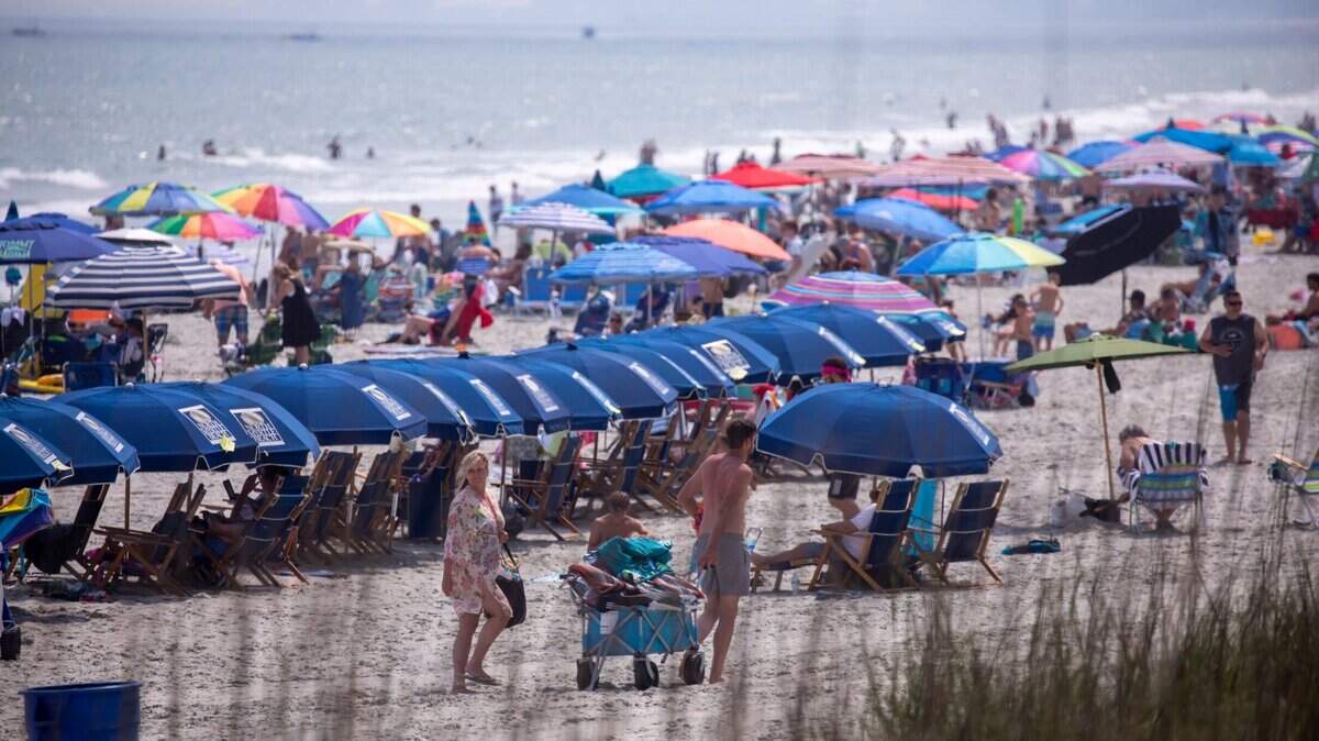 A summer haze blankets beach crowds in North Myrtle Beach, S.C. June 9, 2023.