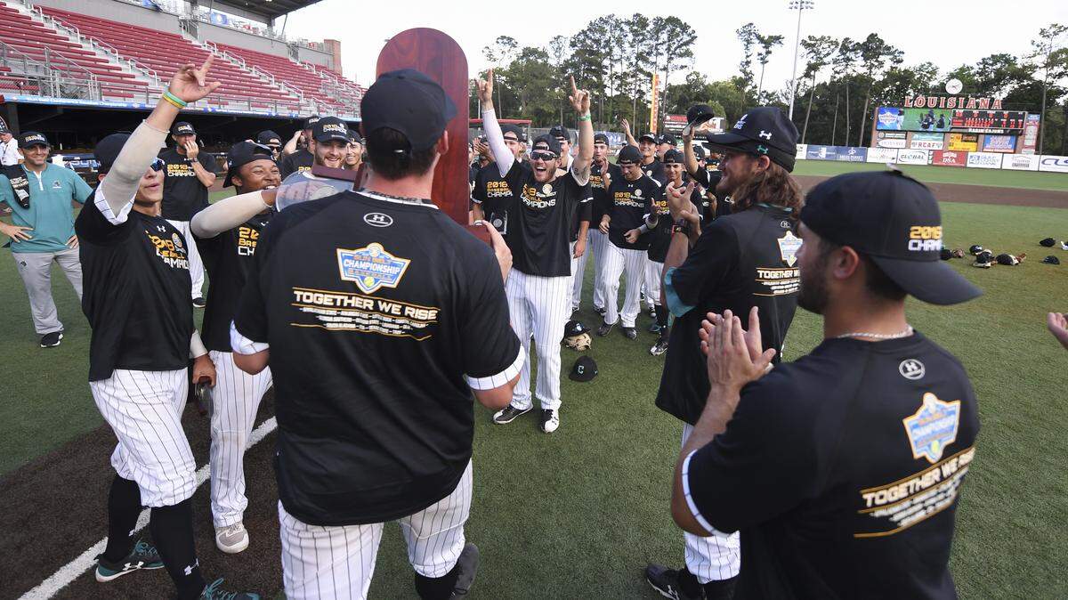 Coastal Carolina players celebrate their 2018 Sun Belt Conference tournament championship Sunday at Russo Park in Lafayette, La.