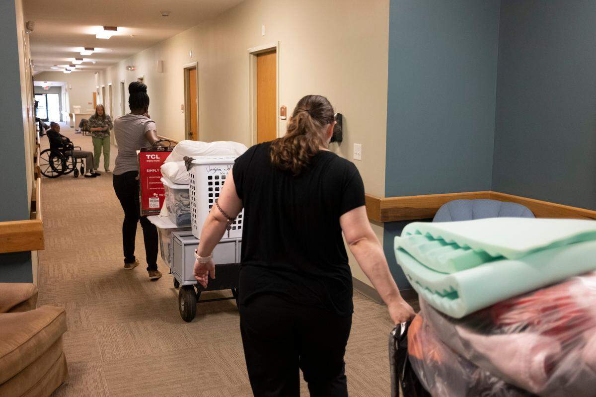 Staff members at the Oaks of Loris help to pack up resident’s belongings after State health officials revoked their license despite new ownership’s hopes of keeping the Loris facility open. May 10, 2023.