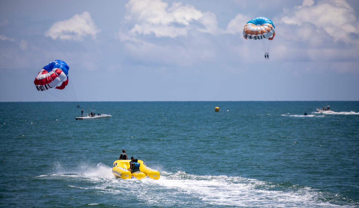 Banana boats and parasails fill the coastline of Myrtle Beach in summer. In the summer heat of July, Myrtle Beach area residents and tourist look to the water for relief. With waterparks, jet ski rentals, parasails, banana boat rides, paddle boards and kayaks, there are plenty of options to beat the heat. July 5, 2022.