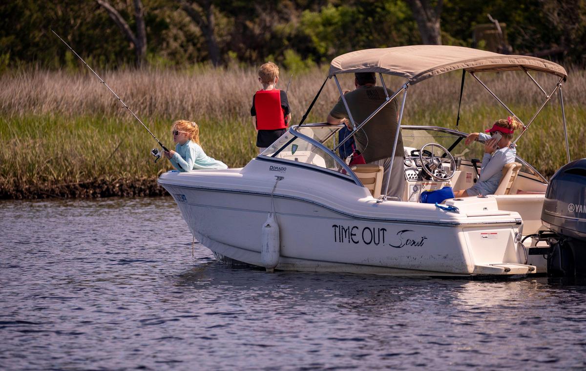 Harper Shook fishes with her family on the Intracoastal Waterway in Little River on Friday. South Carolina Governor Henry McMaster closed public boat landings on March 30th, but reopened them today allowing residents back onto public waterways while following social distancing orders. April 17, 2020