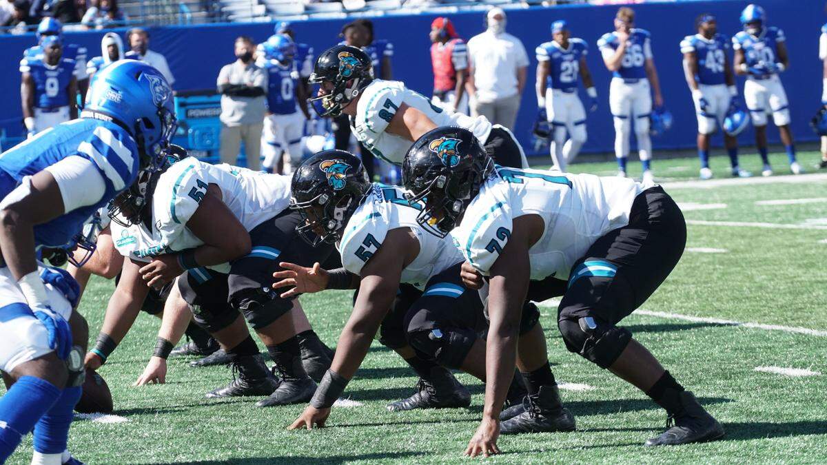 The left side of the Coastal Carolina football offensive line consisting of junior tackle Antwine Loper (72), freshman guard Willie Lampkin and senior center Sam Thompson (51) line up against Georgia State in Coastal’s 51-0 win over the Panthers at Center Parc Stadium in Atlanta on Saturday. Oct. 31, 2020.
