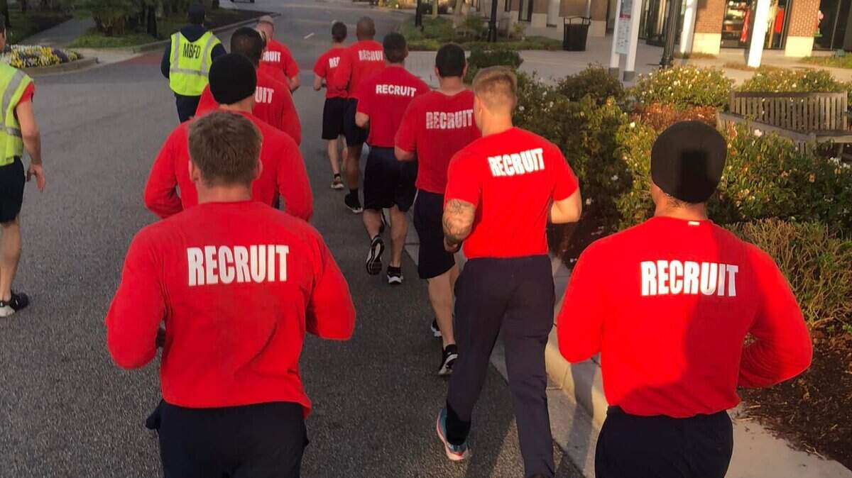 A Myrtle Beach Fire Department recruit class runs through Market Common during February 2022 as part of their physical training.