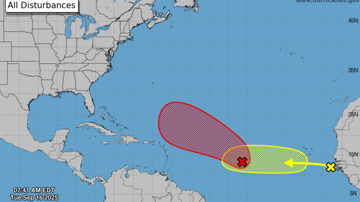 A tropical disturbance, shown in red, is moving northwest across the Atlantic. Via the National Hurricane Center.