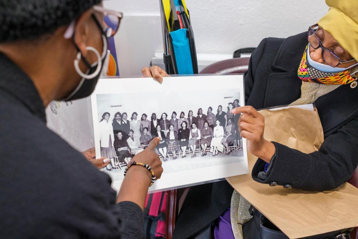 Reverend Cheryl More Adamson (left) and Joe Ella McQueen, former students of Whittemore Elementary School, reminisce about life at the historically Black 1950’s era “equalization school.” They say that the school was a cultural center that brought pride to the community. Nov. 5, 2021.