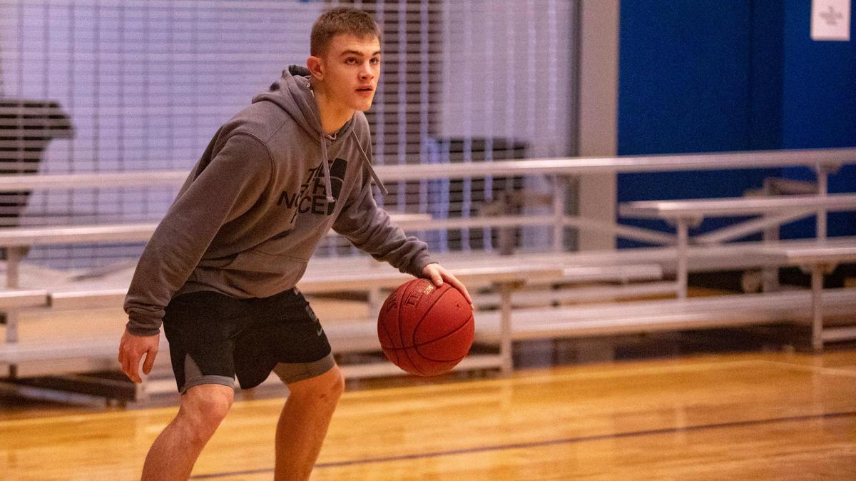 University (W.Va.) High point guard Kaden Metheny dribbles during practice Friday at the Myrtle Beach Sports Complex. Matheny put on a shooting display Wednesday night in the Beach Ball Classic, tying the tournament record for the most three-point field goals in a game with nine against Cox Mill (N.C.).