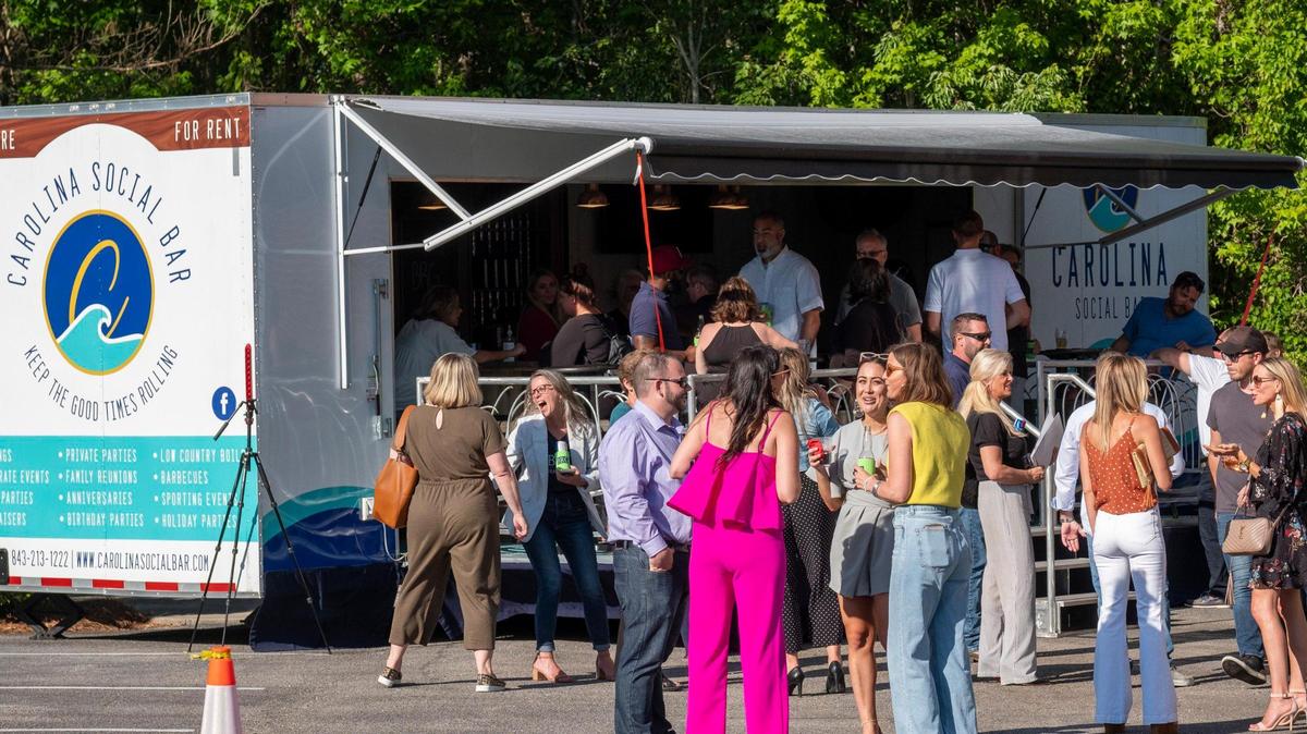 Carolina Social Bar is a mobile pub that was booked for a BRG Realty party on Wednesday at the company office building on Professional Drive in Myrtle Beach. The bar on wheels offers beer, wine, liquor, bar stools, tables and chairs, and two TVs, as well as catering. It is owned in part by Nick Vaugh, his brother Jesse Vaugh and sister-in-law Jill Vaugh, and family members work the trailer. April 28, 2021.