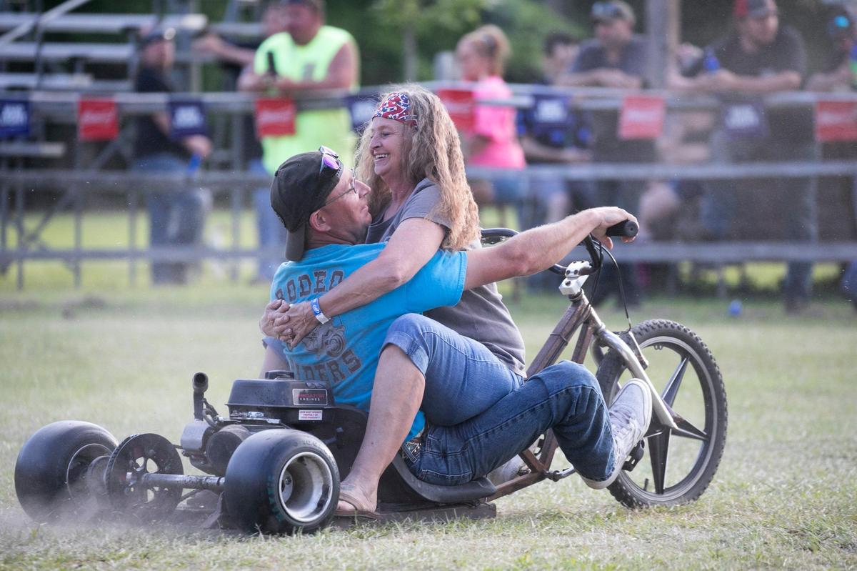 Paula Trella rides with Charles Williams to entertain the crowd at the Rat Hole’s Motorcycle Rodeo. The annual events are held daily at The Rat Hole during the Myrtle Beach Spring Bike Rally with events such as the waitress carry, keg roll, balloon toss and bite the weiner contests. May 15, 2019.