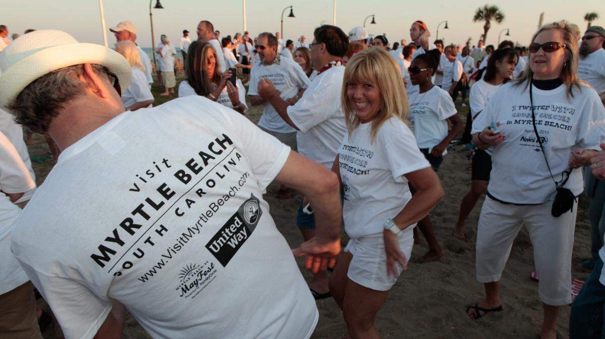 More than 1,900 people gather to attempt to break the world record for most people dancing “The Twist” at the Beach Music Festival in downtown Myrtle Beach in 2011. In addition to Chubby Checker, Performers include The Spinners, The Embers, The Catalinas, Atlantic Groove, The Craig Woolard Band and Too Tight. Photo by Matt Silfer for The Sun News.