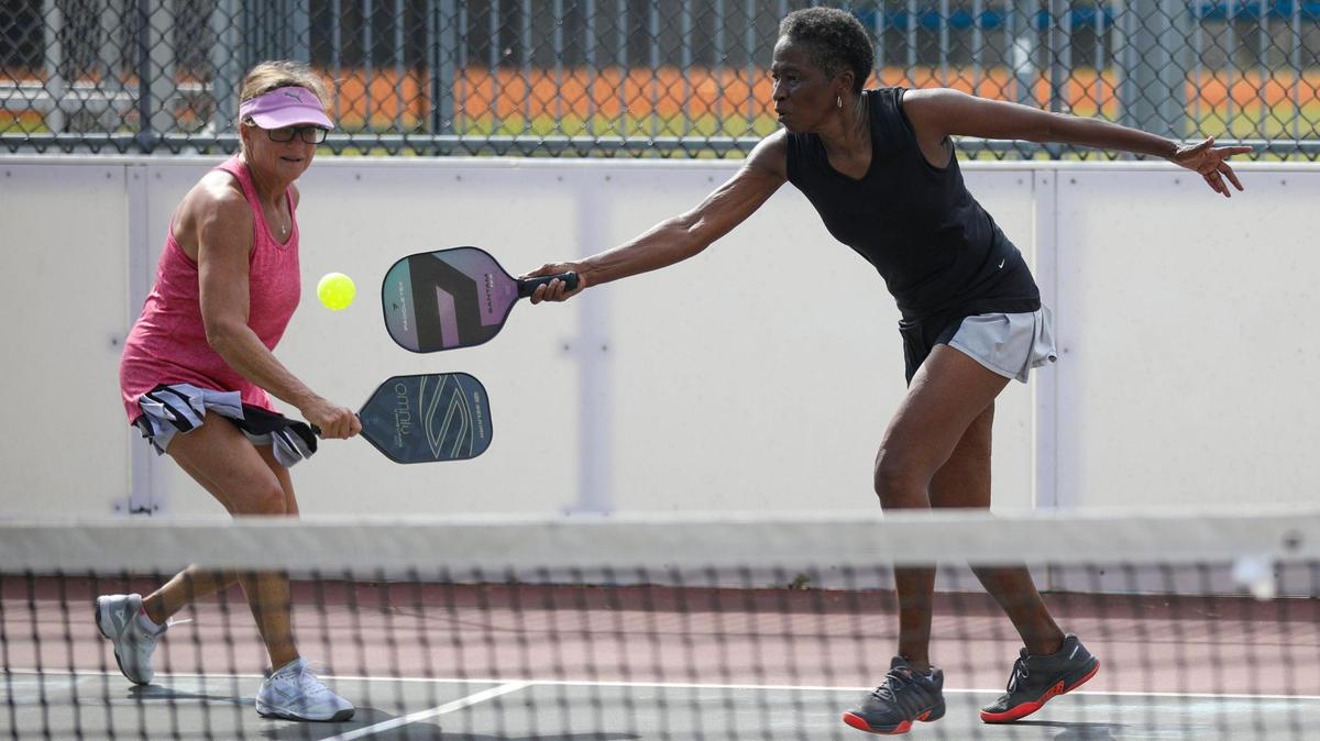 Lynn Palmer (left) and Tina Hayes group play pickleball in Central Park, North Myrtle Beach, S.C. on Tuesday. Pickleball, invented in 1965, is considered America’s fastest growing sport, according to a 2022 report by the Sports and Fitness Industry Association. October 17, 2022.