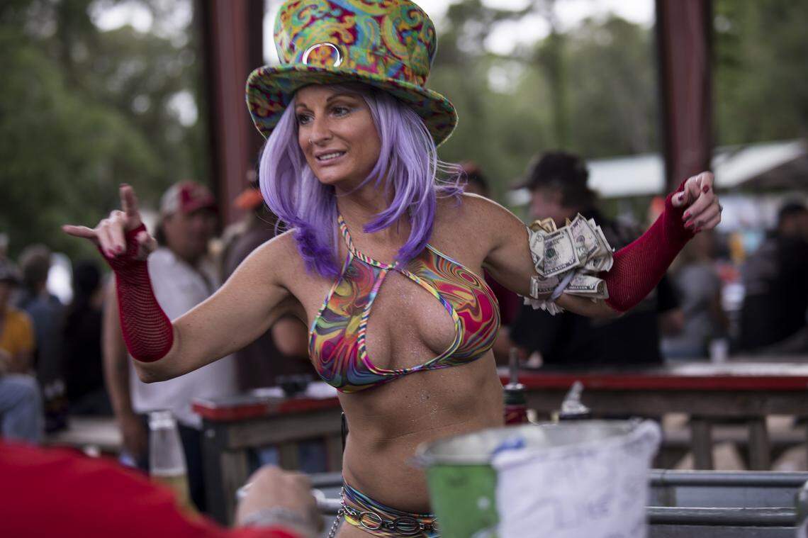 A bartender waits on customers at Spokes and Bones in Murrells Inlet. Myrtle Beach Bike Week kicked into high gear Murrells Inlet area venues on Friday evening. May 17, 2018. 