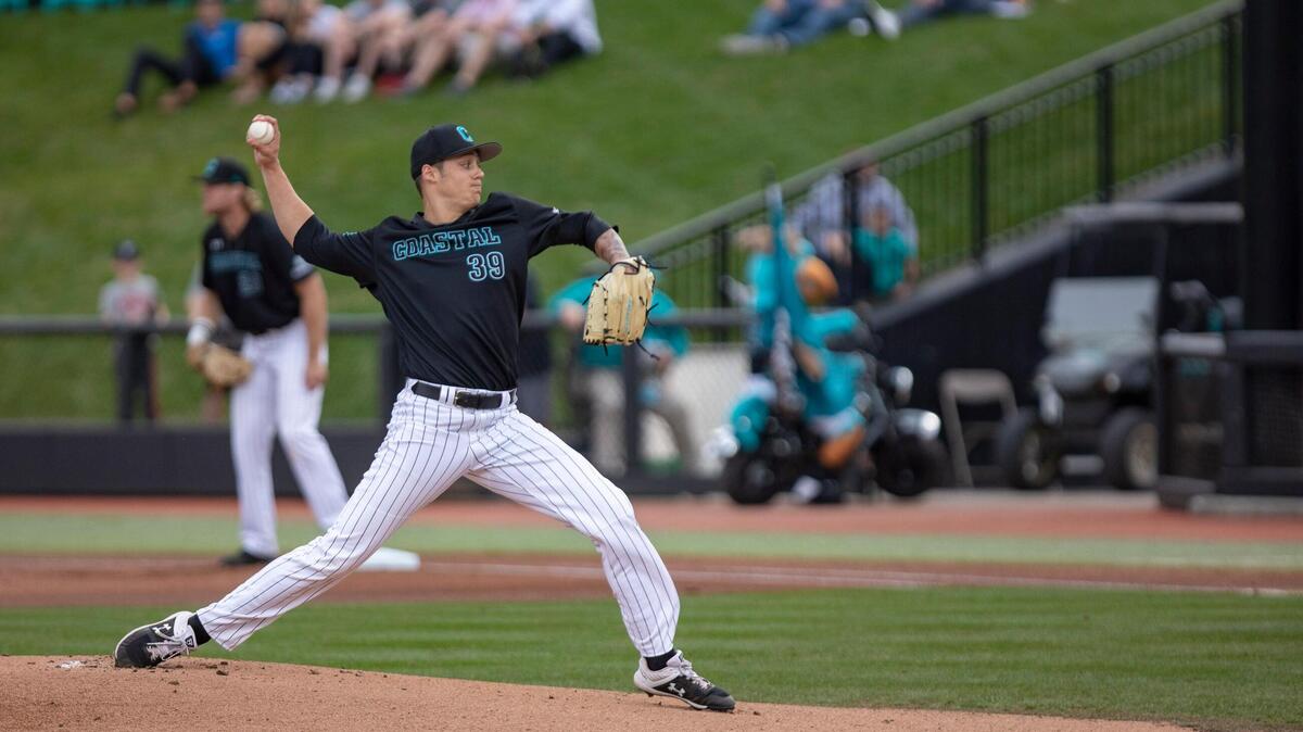 Coastal Carolina sophomore pitcher Zach McCambley warms up prior to throwing the first pitch of the 2019 season against VCU at Springs Brooks Stadium Friday.