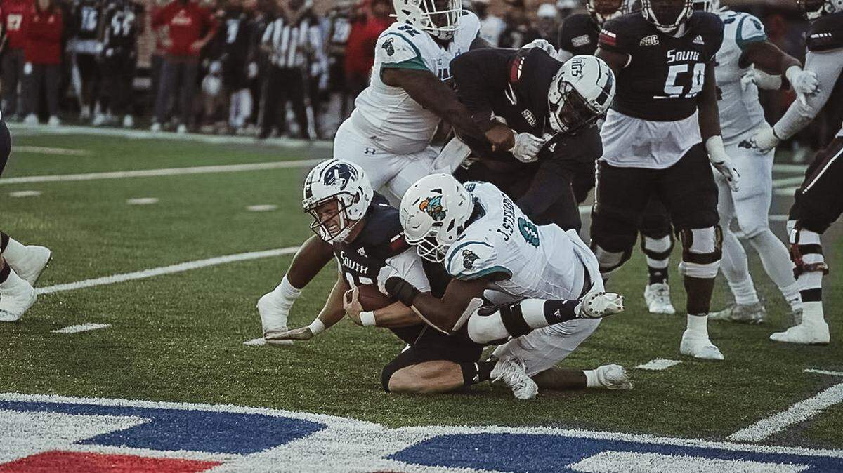 Coastal Carolina freshman defensive end Josaiah Stewart sacks South Alabama quarterback Jake Bentley on Friday at Hancock Whitney Stadium, Mobile, Ala. Stewart set the CCU single-season record for sacks.