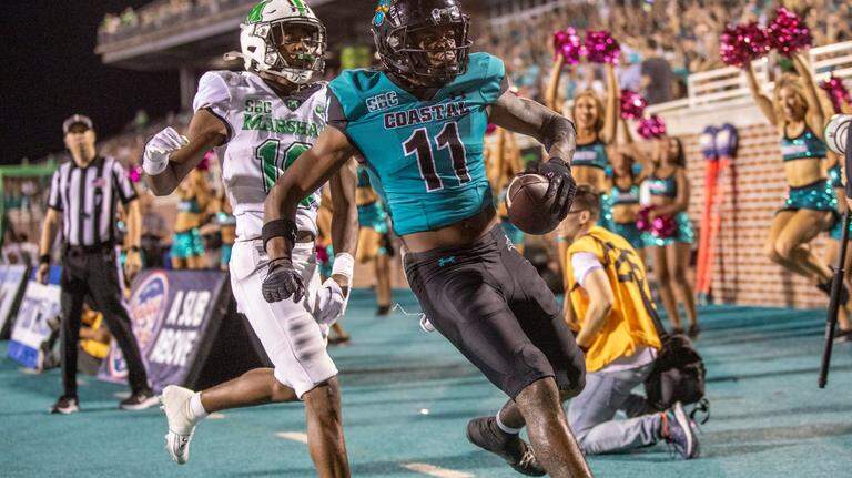 Photos: Coastal tramples the thundering herd