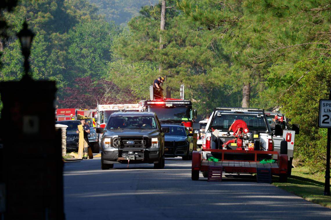 Fire crews sit at the entrance of Black Creek Plantation in Carolina Forest. Horry County Fire Rescue reported that three residences on Red Wolf Trail in the Myrtle Beach area were evacuated Tuesday, April 2, 2026.