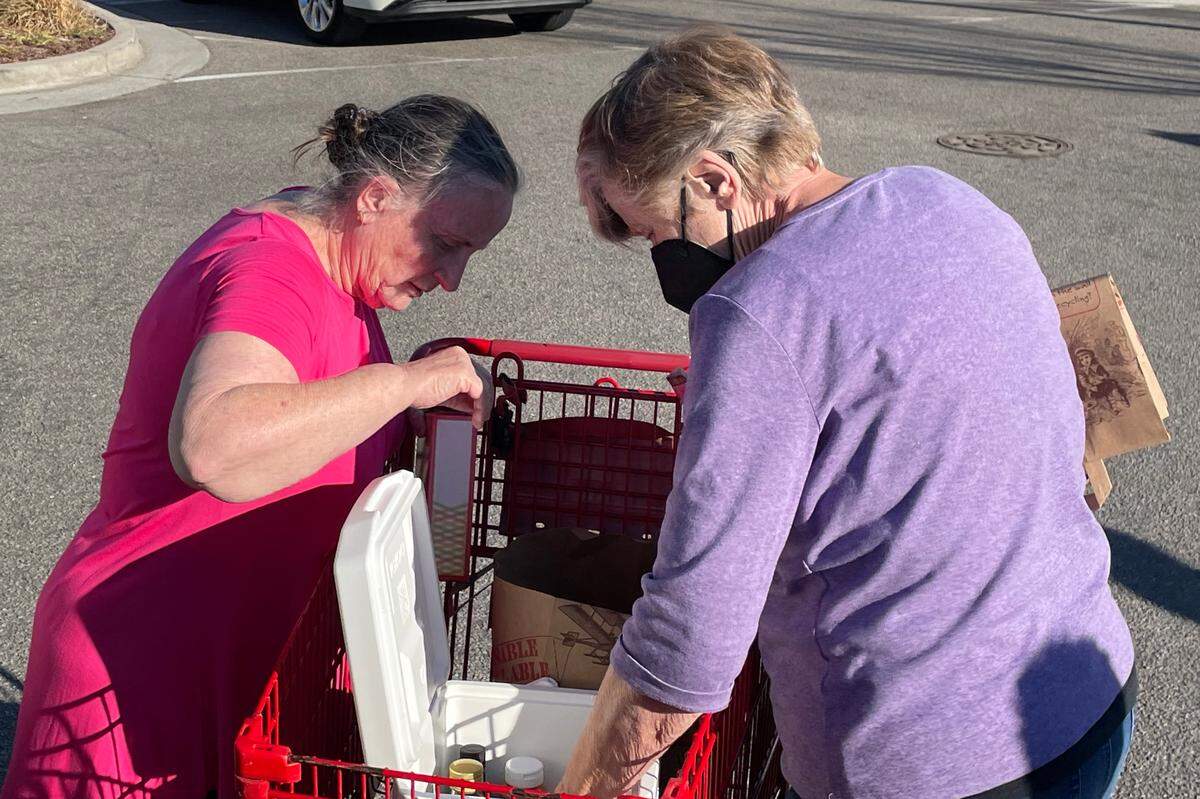 Ellen Jampole, left, and Sheila Rudesill move food the pair bought at Trader Joe’s in Wilmington, N.C. into a cooler for the drive back to Myrtle Beach. The pair went on a trip to the popular grocery store along with nine others as part of Senior Adventures in Learning and Travel because Myrtle Beach doesn’t have a Trader Joe’s.