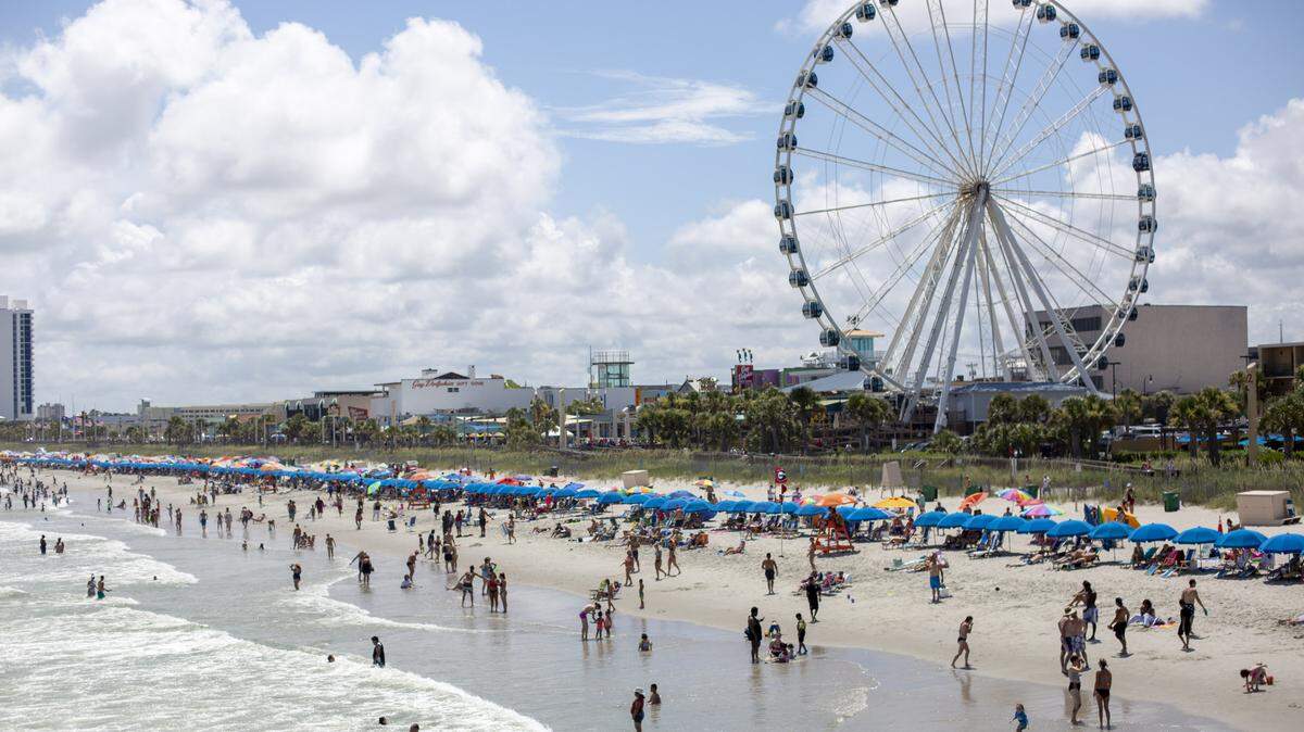A view of the beach and SkyWheel looking south from Pier 14 in Myrtle Beach on July 4.