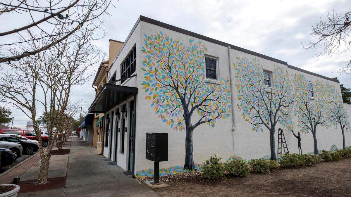 A new mural called “Give a Child Some Paint,” painted by Tommy Simpson, decorates the side of one of the historic buildings in the Broadway District of Myrtle Beach, S.C. February 1, 2023. The area is being further developed and revitalized with the assistance of the Myrtle Beach Downtown Alliance.
