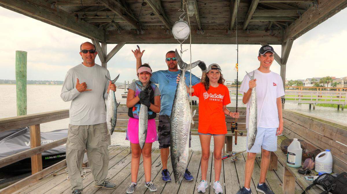 Dr. Jason Rosenberg, Ruby Rosenberg, Capt. Jay Sconyers, Lainey Rosenberg and Zachary Rosenberg show off their mackerel catch from Wednesday aboard Painkiller out of Murrells Inlet.