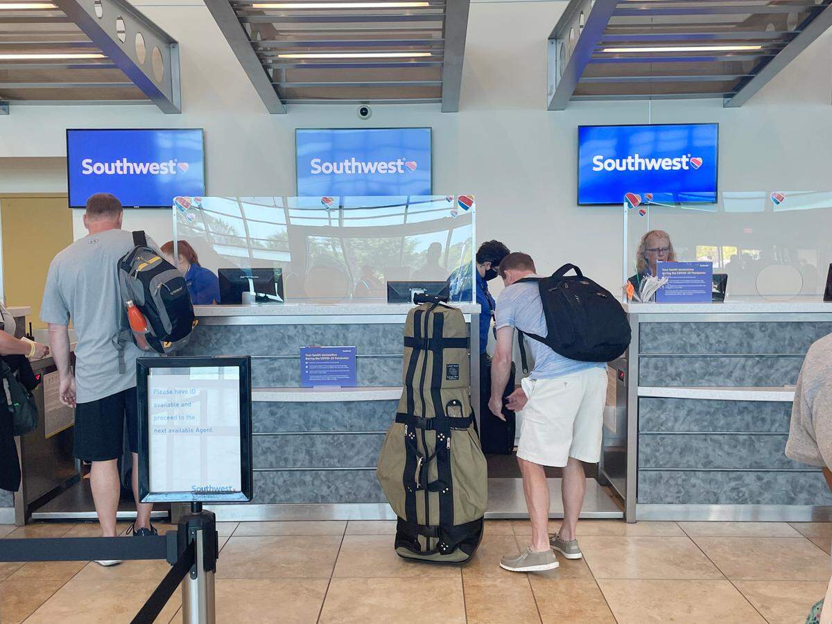 Only one of the four Southwest Airlines employees working at Myrtle Beach International Airport on Saturday, April 23, 2022, wore masks. A federal judge had struck down the federal COVID-19 mask mandate five days earlier.