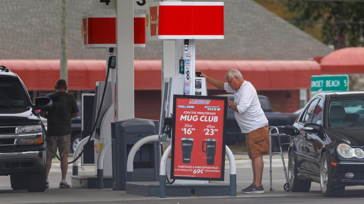 Customers fill their cars with fuel at gas stations just over the North Carolina line on Monday, March 24, 2025.