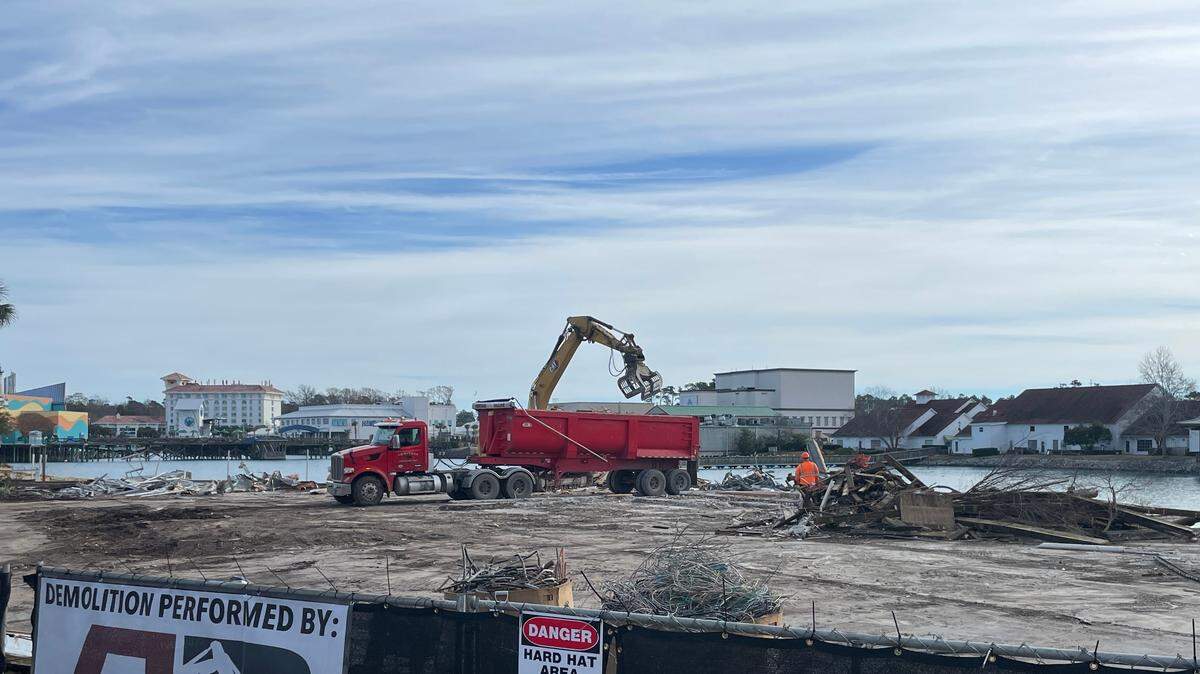 Workers removed debris from demolished restaurants at Broadway at the Beach on Dec. 30, 2024. The demolished restaurants could be replaced by a distillery and bar.