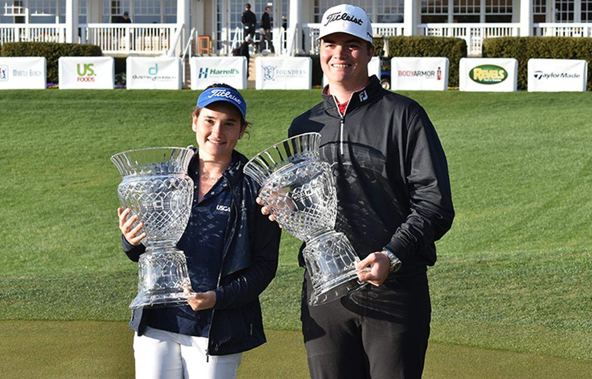 Tyler Wilkes of Tampa, Florida (right) and Taylor Roberts of Parkland, Florida hold the championship trophies Sunday at TPC Myrtle Beach after winning the boys and girls divisions of the fifth annual Dustin Johnson World Junior Golf Championship.