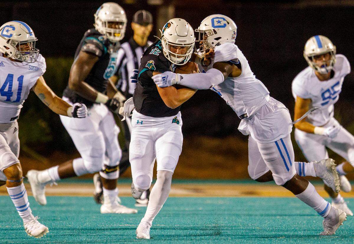 Coastal’s Bryce Carpenter scrambles with the ball in the fourth quarter against The Citadel. Coastal Carolina University hosted The Citadel in game one of the 2021-22 season. Aug. 11, 2021.