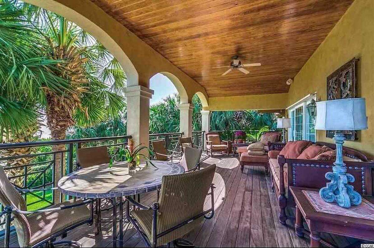A gated beach house is for sale in Myrtle Beach on Ocean Boulevard for nearly $3 million. It has an oceanfront terrace, fitness room and two car garage.