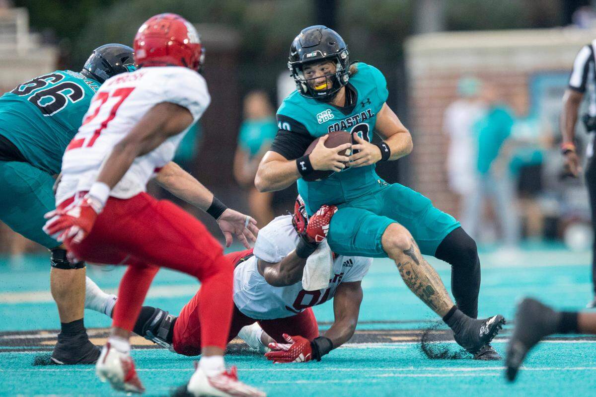 Grayson McCall rushes against Jacksonville State’s Austin Ambush on Saturday. Coastal Carolina University takes on Jacksonville State in the chanticleers first home game of the 2023 football season. Sept. 9, 2023.