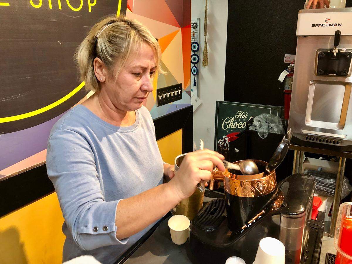 Social Coffee Shop co-owner Pinar Akyurek brews Turkish coffee in her Broadway at the Beach shop. Coffee fans in Myrtle Beach, S.C. can try brews from around the world for National Coffee Day. Sept. 27, 2023.
