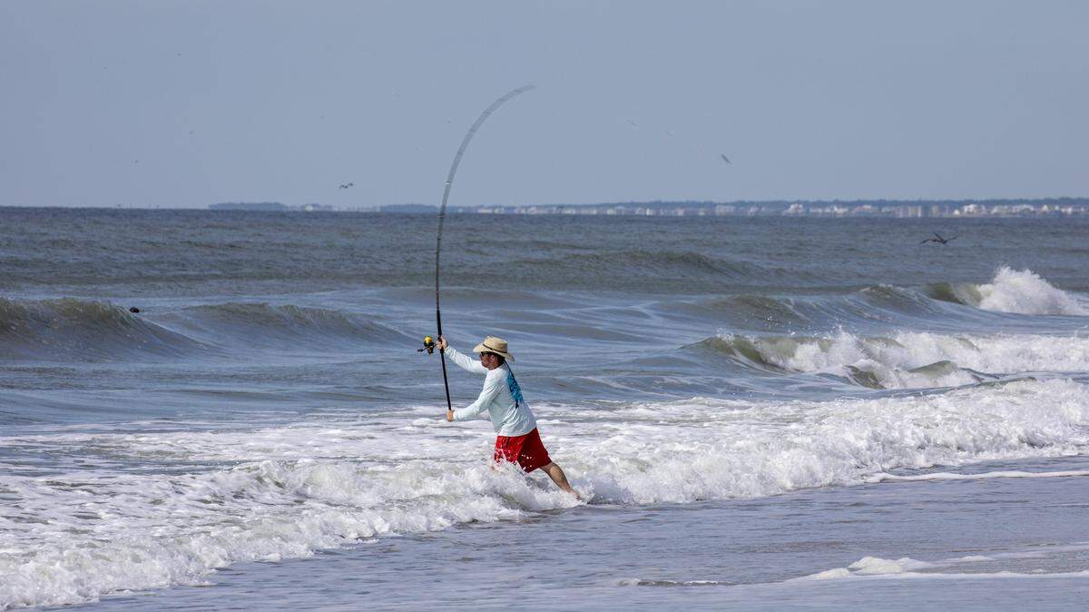 A surf fisherman cast his line at Huntington Beach State Park in Murrells Inlet, S.C. Fishing locations along the Grand Strand. File. July 14, 2022.
