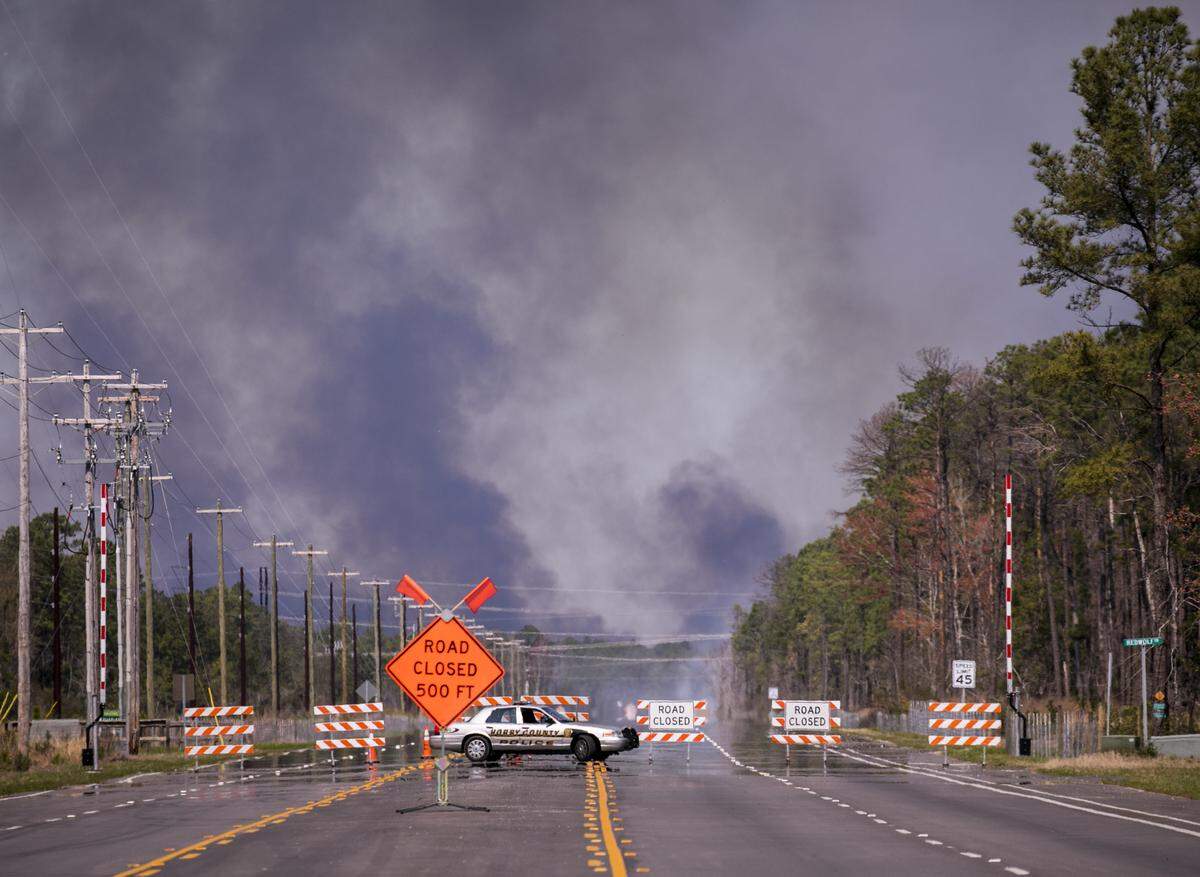 A controlled burn off International Drive has the road closed on Monday, March 18, 2019.