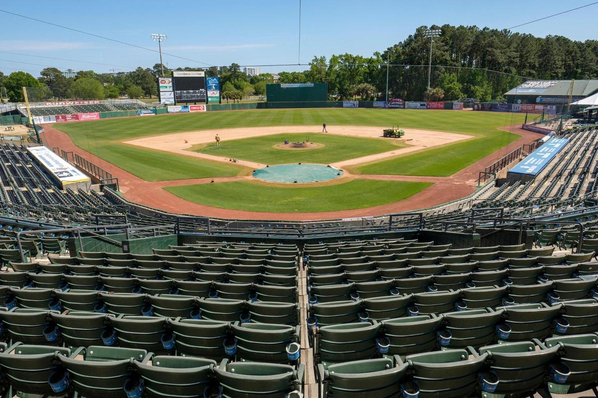 Grounds keepers work to prepare the TicketReturn.com Field at Pelicans Ballpark for the 2021 season on Thursday. The Myrtle Beach Pelicans begin the 2021 season on May 4 and play their home opener on May 11 against the Augusta GreenJackets, Low-A affiliate of the Atlanta Braves. Myrtle Beach will limit attendance due to the coronavirus to 50 percent capacity, or 3,300 spectators, in May at Pelicans Ballpark. April 22, 2021.