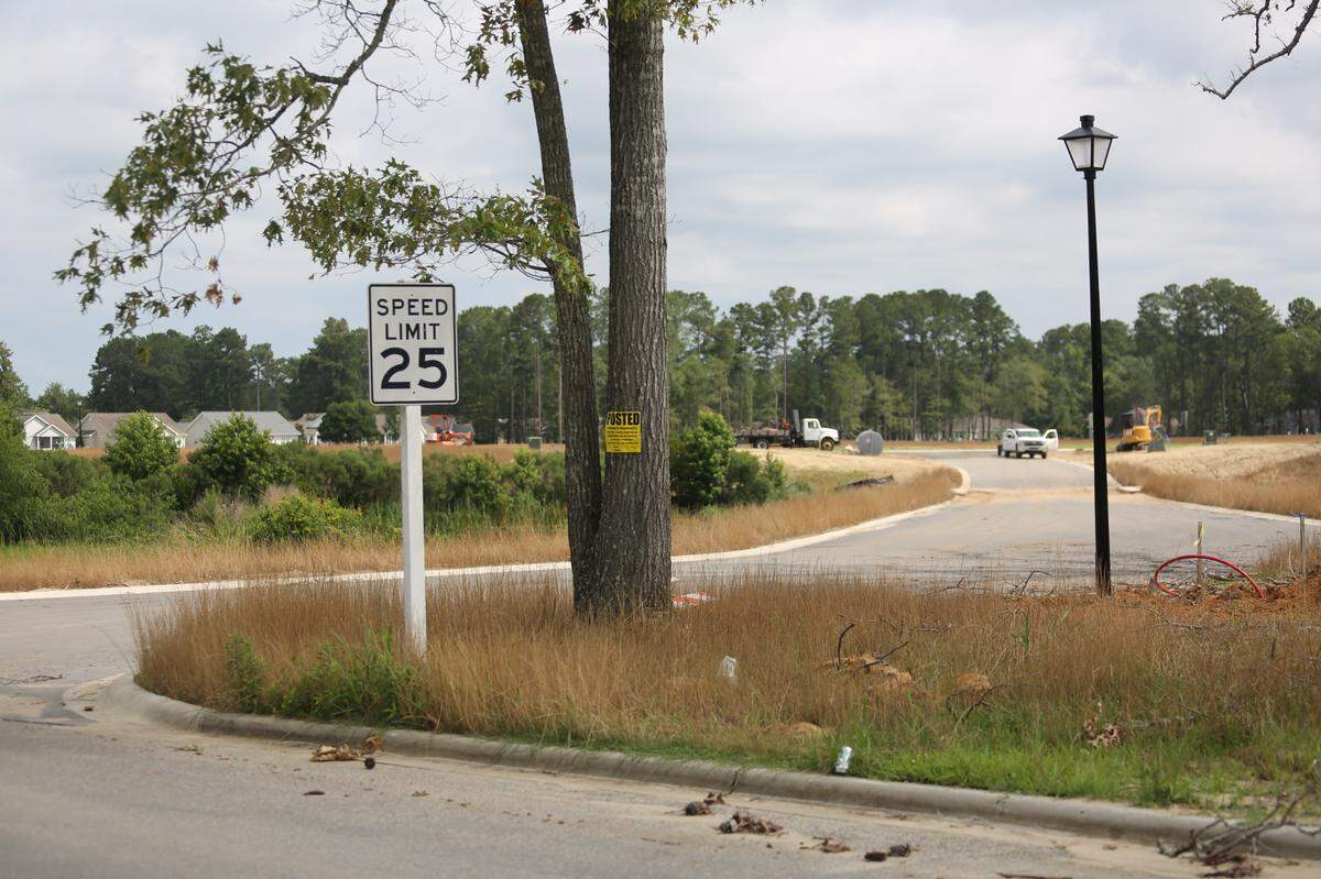 The bridge and entrance to a construction site in the Island Green community, in Burgess. Resident Dawne Dunton videotaped damage to the bridge after a rainstorm and was arrested for trespassing. A road that residents use runs past the bridge.