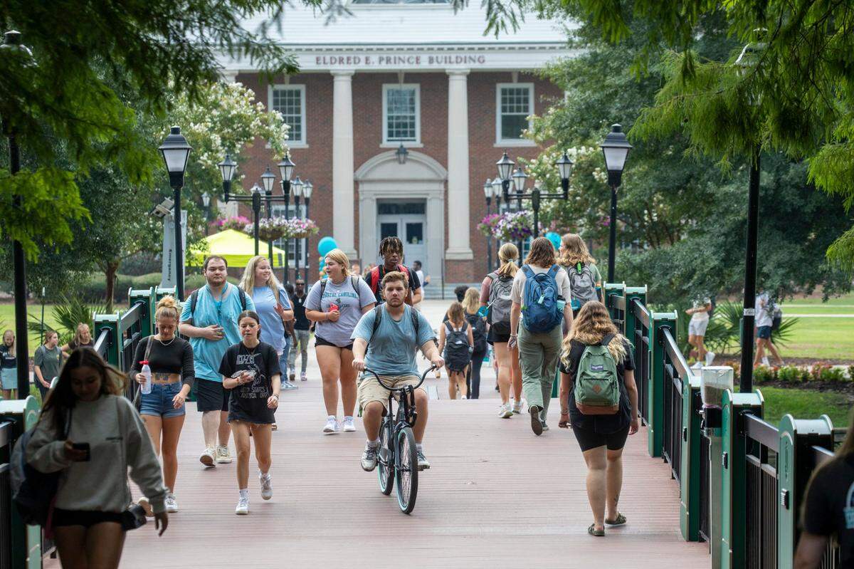 Students make their way between classes on the first day of the 2022 fall semester at Coastal Carolina University on Wednesday, Aug. 24, 2022.