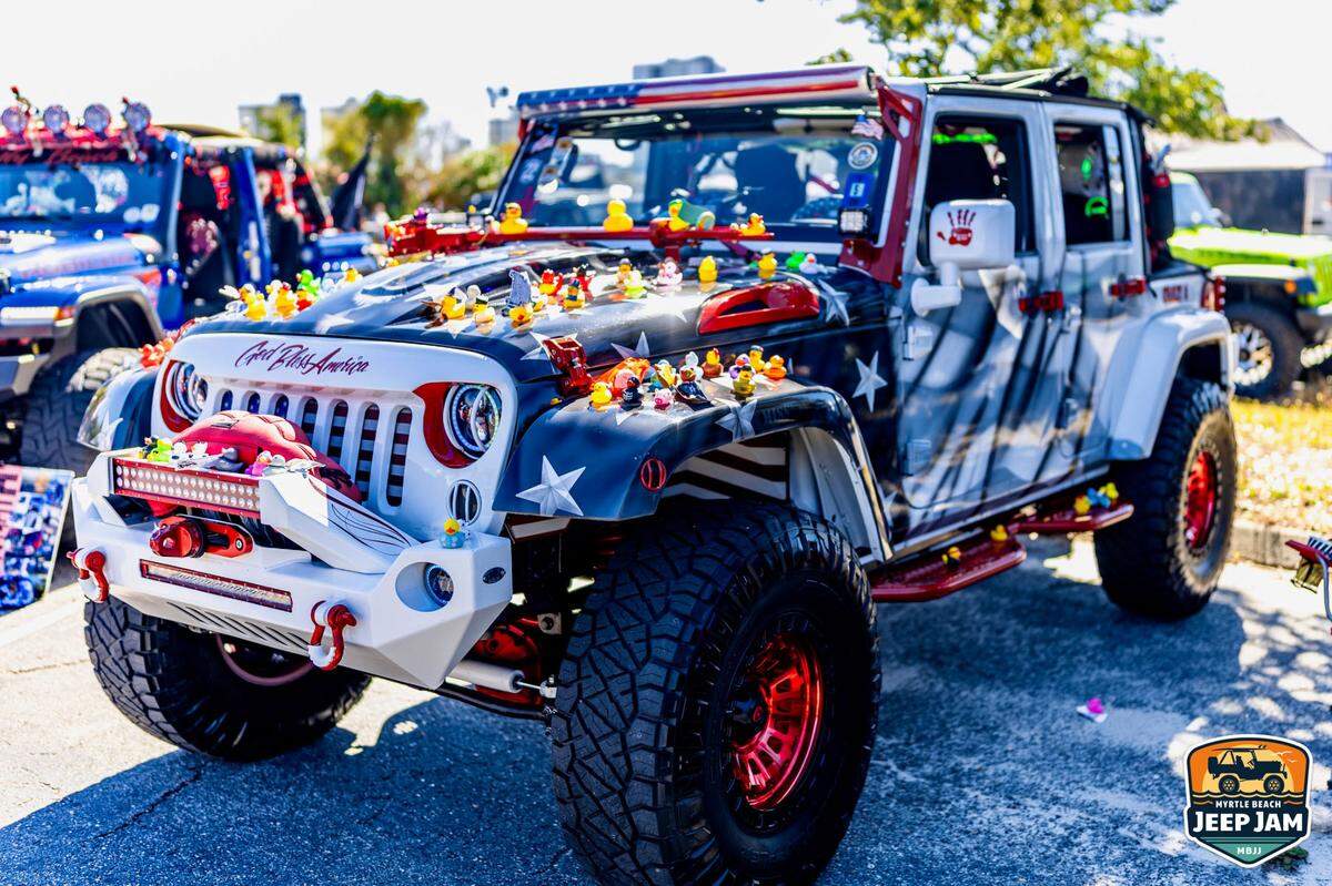 A customized Jeep at the 2023 Myrtle Beach Jeep Jam is decorated with dozens of rubber ducks. via Myrtle Beach Jeep Jam