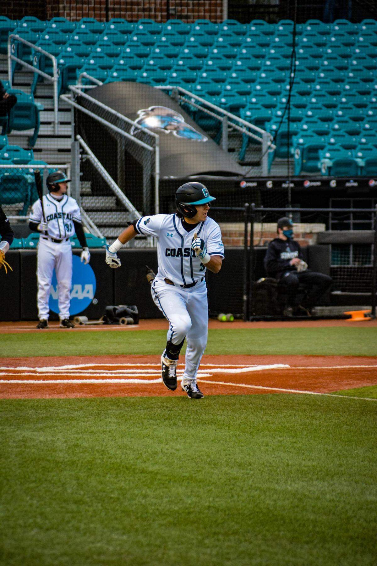 Coastal Carolina outfielder Parker Chavers takes part in an intrasquad scrimmage during preseason practices in February 2021.