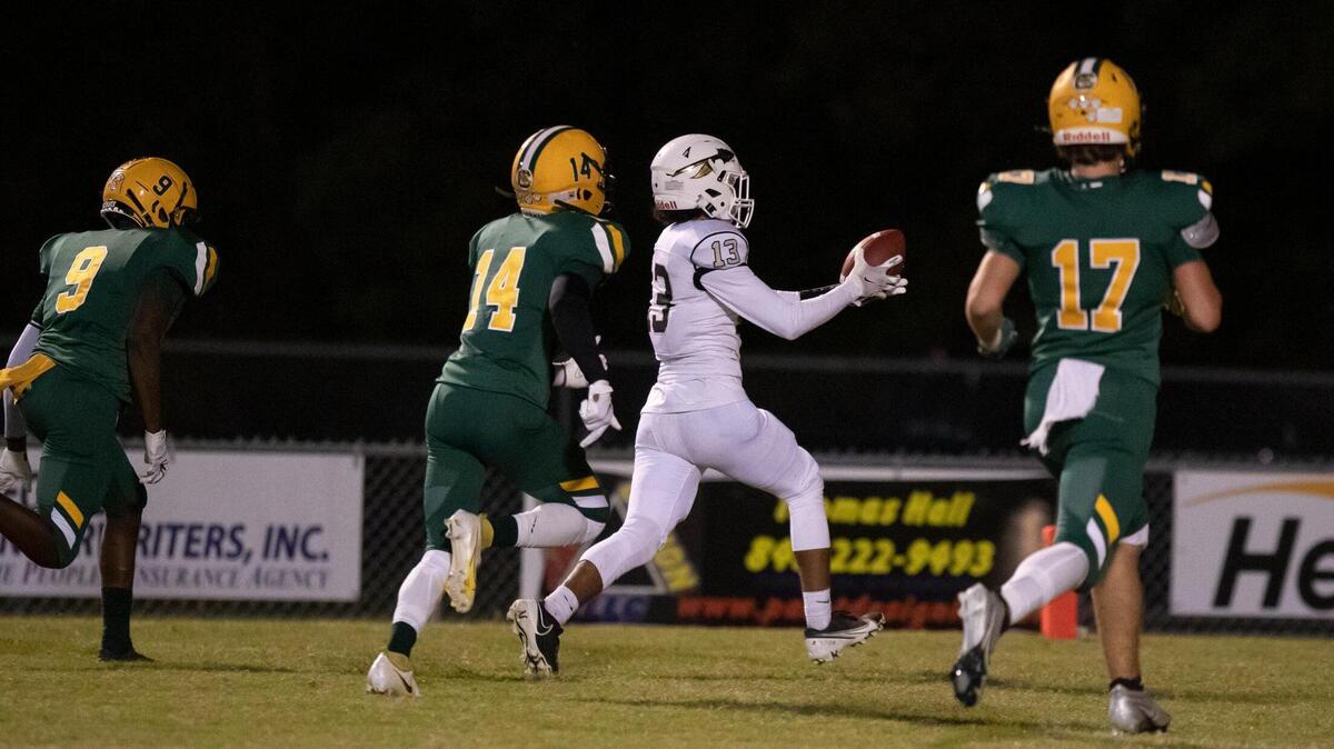 Socastee wideout Raymond Christian (13) catches a pass for a touchdown during 1st quarter action against Conway Friday night at Conway High School.