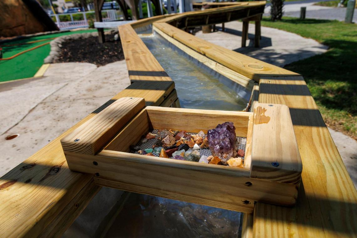 nake River Golf and Gem Mining, an abandoned mini-golf entertainment complex off Highway 17S in Myrtle Beach has been abandoned for years but will re-open under new ownership soon. A water tower and trough will have running water filled with sand and gems, allowing people to use a tray to sift for items. May 2, 2025.