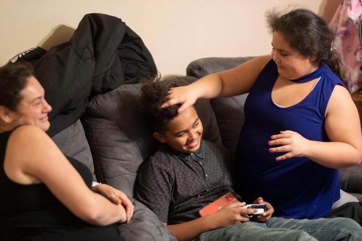 Faith Ruiz plays with her older brother Javier Ruiz, Jr.’s hair. January 28, 2021.