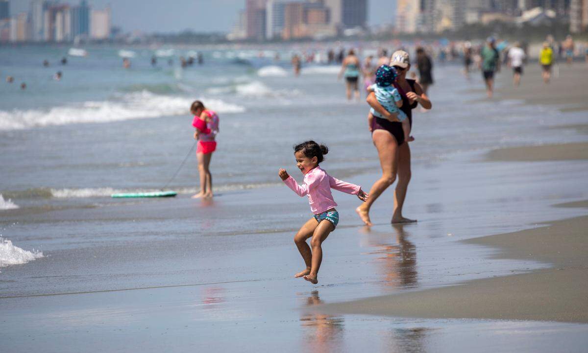 A child jumps the waves in the Arcadian Shores section of Horry County. File photo.